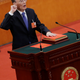 Newly elected Chinese Vice President Wang Qishan with his hand on the Constitution takes the oath at the fifth plenary session of the National People's Congress (NPC) at the Great Hall of the People in Beijing, China March 17, 2018.
